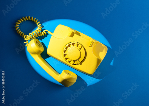 Retro vintage yellow rotary telephone