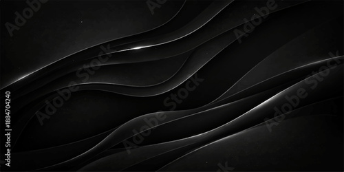 Elegant black silk and satin fabric texture with smooth dark waves and shiny curves creates a luxury textile backdrop for fashion decoration