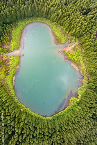 Drone view of Canario Lagoon. Lake formed by the crater of an old volcano in San Miguel island, Azores, Portugal. Scenic landscape. Ghost shape aerial illusion.
