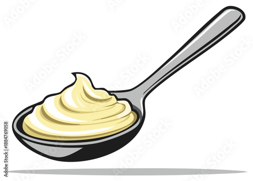 Creamy yellow sauce dolloped onto a shiny metal spoon ready to be served
