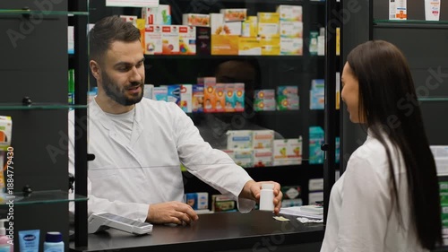 Pharmacist recommending medicine and customer paying contactless