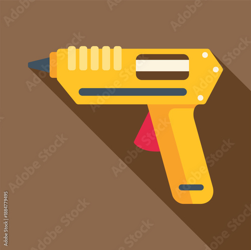 Yellow hot glue gun with a long shadow on an isolated background