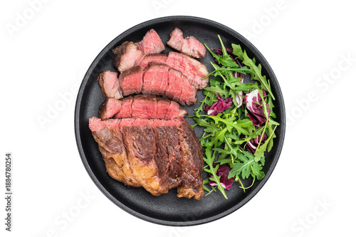 Photos Sliced beef chuck eye roll steak cooked medium rare with fresh salad