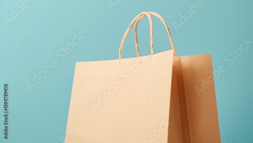 Colorful Shopping Bags Hanging Against a Plain Background Showcasing Modern D...