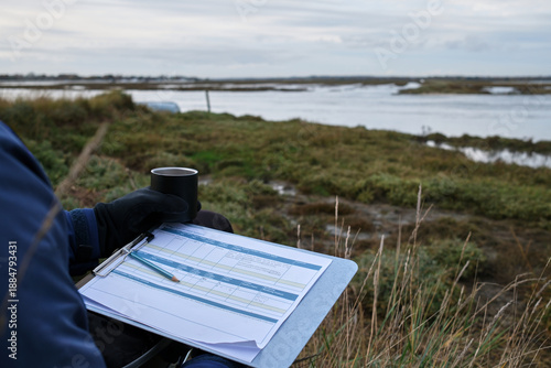 Photos Environmental Restoration Project Data Collection and Audit on Clipboard in Tida