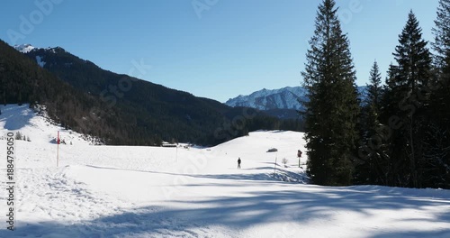 Spitzingsee, ski area in Bavarian Alps. Valepperalm lift. Skiing facing the slopes of Schwarzenkopf and Hinteres Sonnwendjoch on horizon
