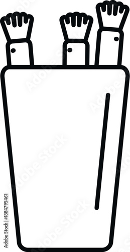 Makeup brushes standing in a container, illustrating beauty and cosmetic tools