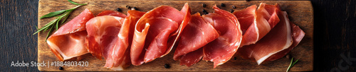Prosciutto Ham Slices on Wooden Board Top View Italian Dry Cured Meat with Herbs for Menu Packaging and Food Advertising
