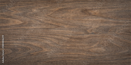 A dark brown natural wood grain texture displays an old hardwood plank pattern on a timber board surface for a rustic design