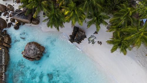 Drone photos of Seychelles beaches from above, showcasing white sand, crystal clear turquoise water, and tropical coastlines in a luxury island paradise setting