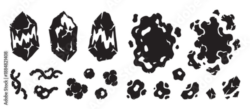 Collection of black linocut style icons featuring fantasy crystals, amorphous slime blobs, spores, and organic shapes with a rough, hand-carved texture for game design