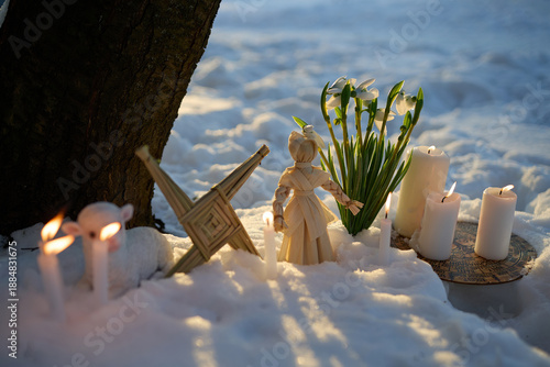 Schilderij op canvas Imbolc pagan ritual with brigid's cross in snow