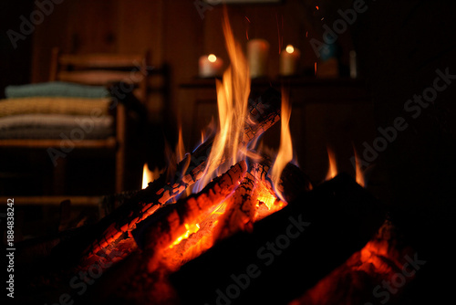 Warm glowing fireplace with dancing flames creating cozy ambiance for winter nights and romantic evenings at home