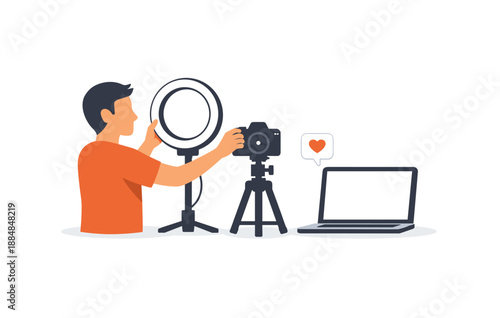 Male preparing photography setup with camera and lighting equipment