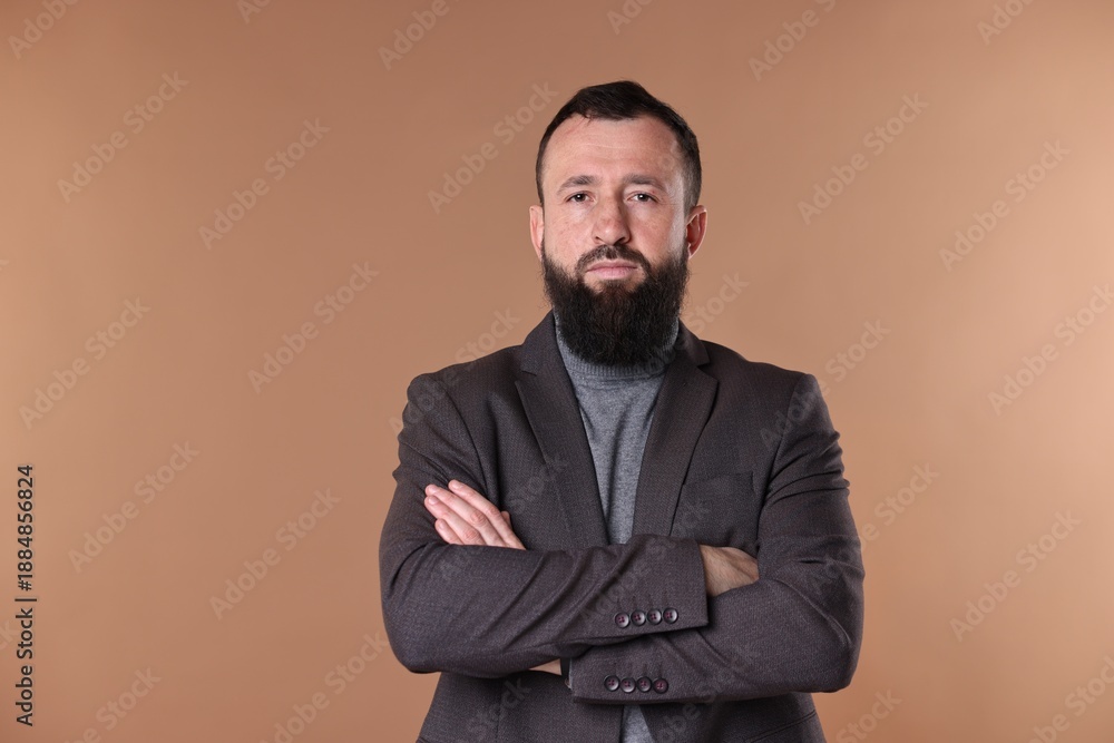 Obraz premium Man with mustache and beard on beige background