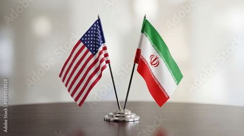 Two flags of the United States of America and Iran together on a table representing the relations between countries