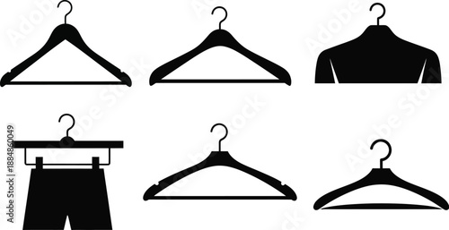 Black clothing hangers in various styles including garments on transparent background silhouette