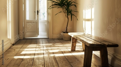 A photo of a simple wood bench in a hallway.