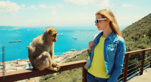 Woman tourist and macaque monkey. Gibraltar
