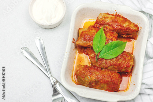 Fotografija Cabbage rolls stuffed with rice and meat stewed in tomato sauce