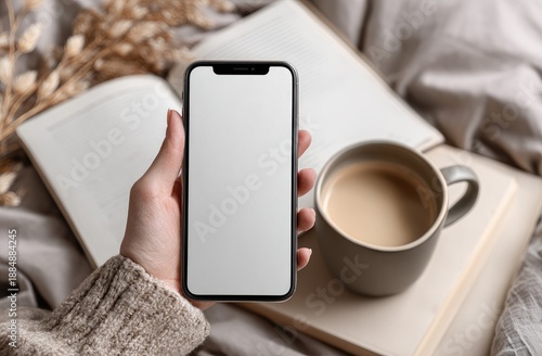 Wallpaper Mural Person Holding Smartphone with Blank Screen Near Coffee Cup and Open Book. Torontodigital.ca