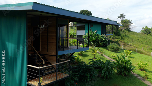 Photos Modern architectural eco lodges integrated into the lush green landscape of a su
