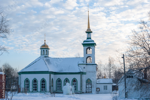 Winter landscape, an old church against the evening sky. Christmas.