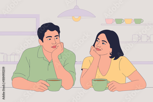 A man and woman sitting at a table with cups of coffee, engaged in a thoughtful conversation