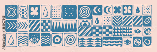 Linocut tile grid close up of blue hand stamped geometric and symbolic icons on pale pink background with horizontal textured