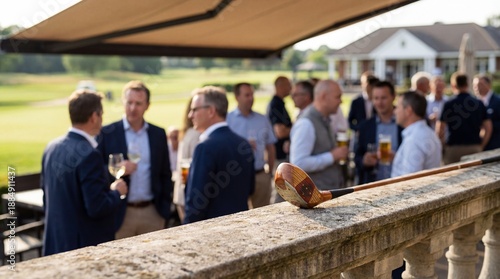Networking on the Green: A sophisticated gathering unfolds on a sun-drenched terrace overlooking a pristine golf course, the air buzzing with conversations and the clinking of glasses.