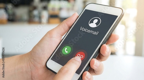 Wallpaper Mural Hand holding smartphone displaying voicemail notification with missed call and message icons on screen Torontodigital.ca