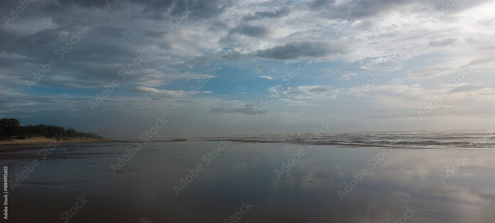 Fototapeta premium Brazil coast at sunset. Dramatic sky, dark clouds. 
