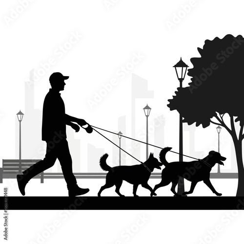 Man walking two dogs in the city park.