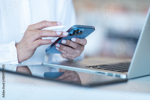 business woman working on smartphone labtop and talbet