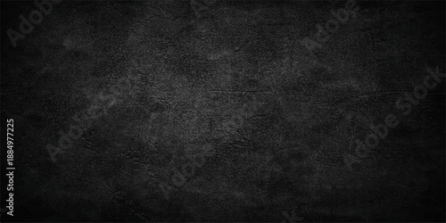 Dark grunge black textured concrete wall background with blank copy space featuring an old vintage stone pattern and dirty gray paper backdrop for design