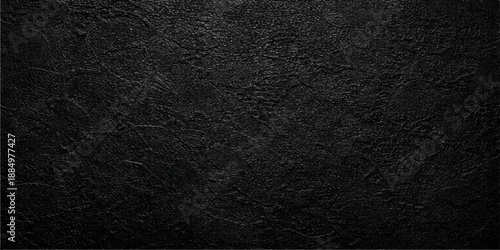 A dark textured black leather background featuring a rough macro material surface with a grunge textile pattern design for a blank backdrop wallpaper