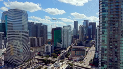 Downtown Miami traverse to Brickell over Miami River. 2026 aerial drone establishing shot