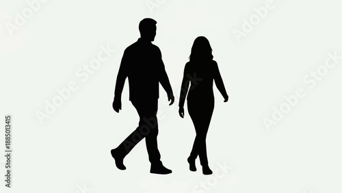 Silhouette of a couple walking together side by side.