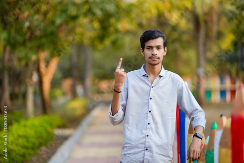 indian indian man showing voting sign