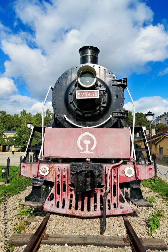 Obraz premium A steam locomotive in the Chinese Eastern Railway History and Culture Square in Zhalantun City, Hulunbuir, Inner Mongolia Autonomous Region, China.