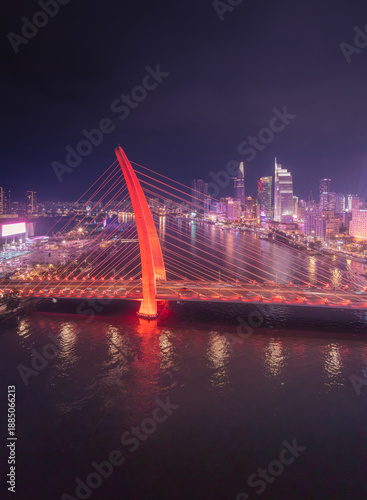 Wallpaper Mural Aerial view of night cityscape in central of Ho Chi Minh city, Vietnam. A Bason bridge with colorful lights at night are so beautiful. Travel concept. Torontodigital.ca
