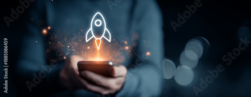 Man holding smartphone with rocket symbolizing digital business launch  