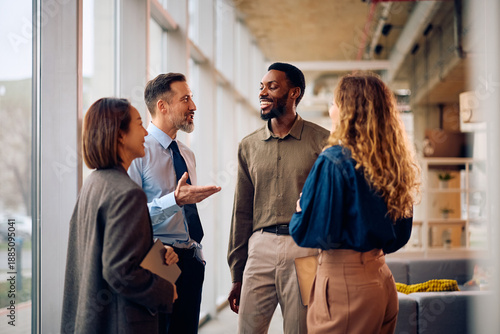 Canvastavla Happy diverse entrepreneurs communicating while working in office