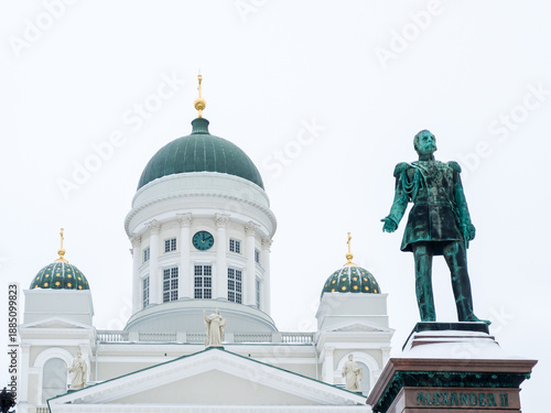 Helsinki, Finland – Winter view of Helsinki Cathedral and the statue of Alexander II with bronze allegorical figures in Senate Square (Senaatintori).