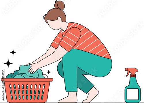Young woman doing household chores squatting by laundry basket with clean clothes and spray bottle for domestic hygiene and home cleaning routine,