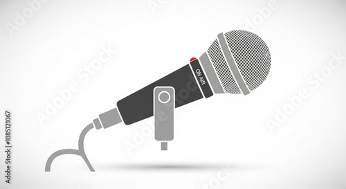Black and gray dynamic microphone on a stand with a red light indicator on a white background for recording or broadcasting
