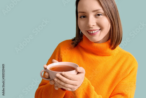 Young woman with cup of tea...