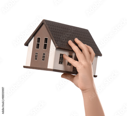 Child's hand with house mod...