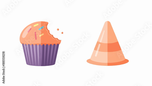 A bitten cupcake with sprinkles and a traffic cone on a white background