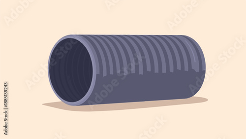 A dark grey corrugated pipe lies on a light beige surface casting a shadow